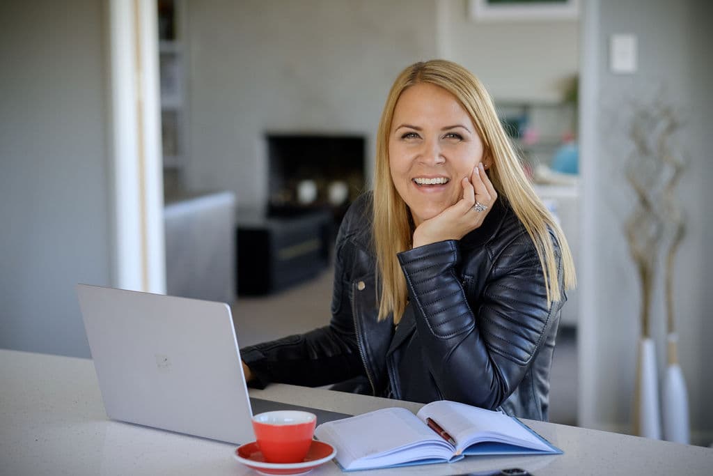 Brigitta Warren at her desk, ready to talk about your next manufacturing hire